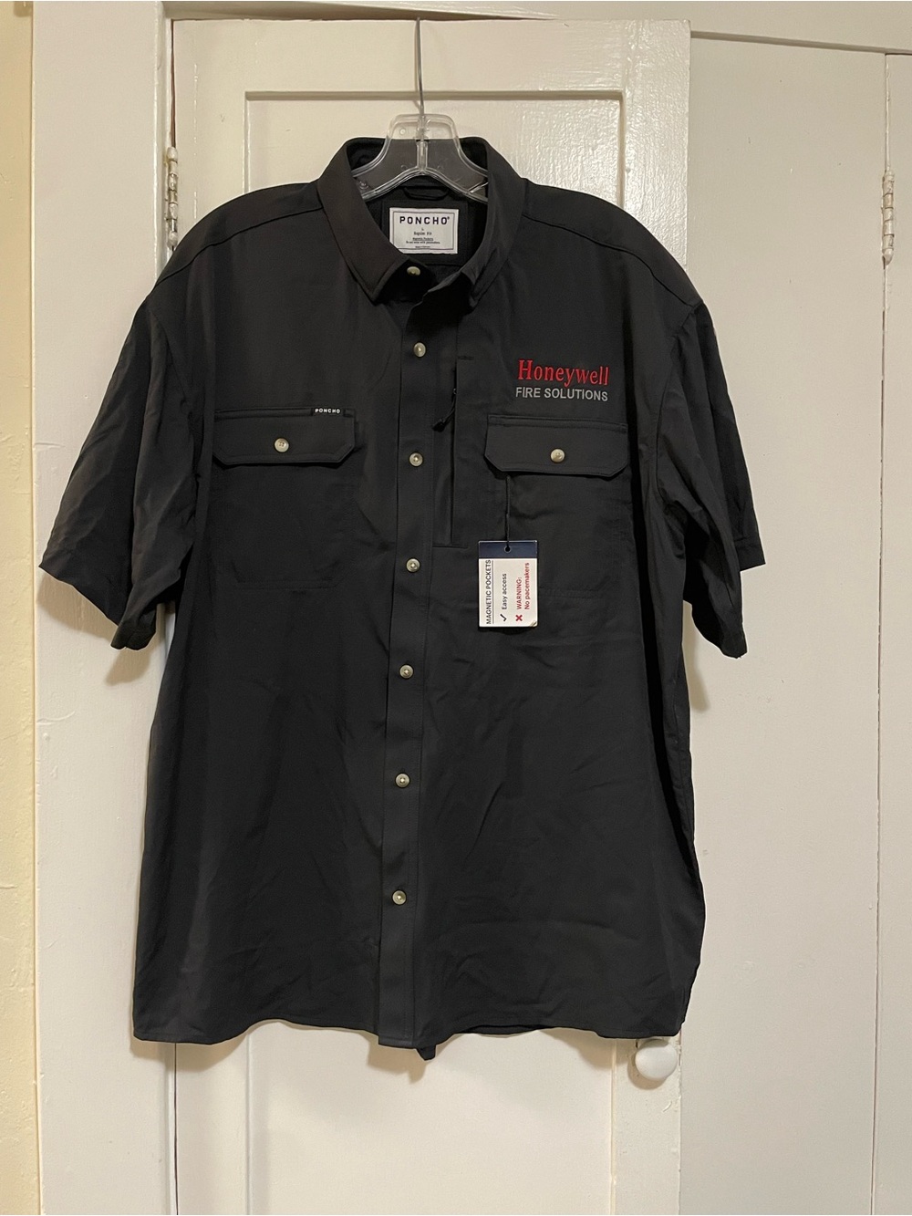Poncho Brand black shirt with business logo embroidered on chest & sleeve large